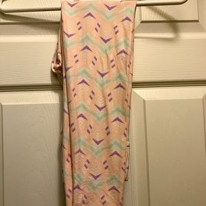 Lularoe OS leggings.  Never worn, peach with purple and teal design.